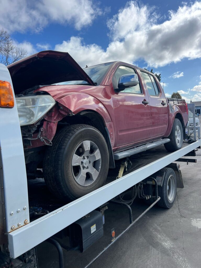 Ute sold to A2Z Auto Dismanttlers being towed on Truck